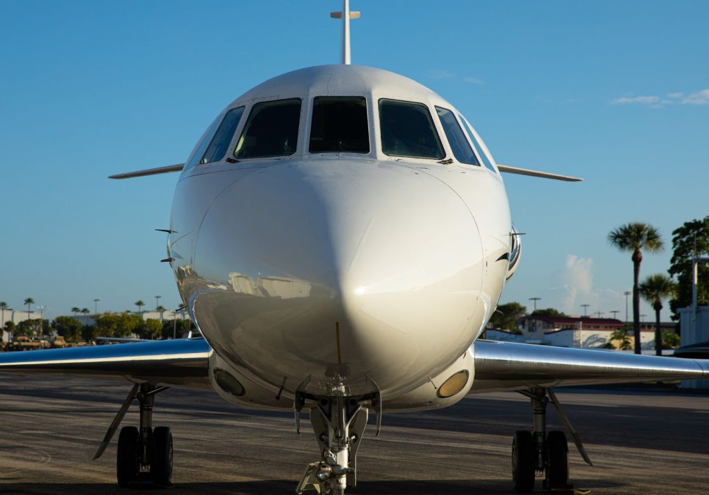 Private jet nose view on the airport ramp