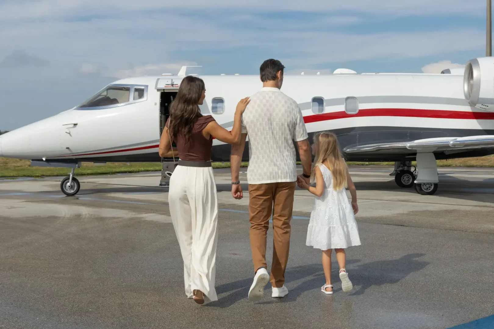 Family boarding a Learjet 60