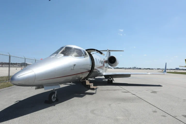 N772EC Learjet 60 private jet parked on the ramp with airstairs deployed